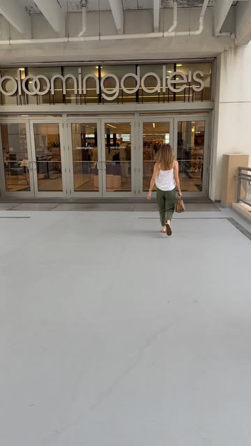 Mara walking into Bloomingdale's for a fall denim try-on