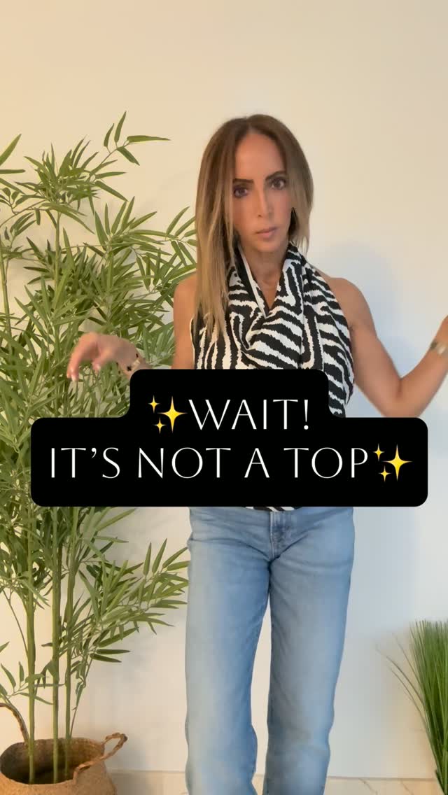 Mara styling a black-and-white scarf as a top with light-wash jeans